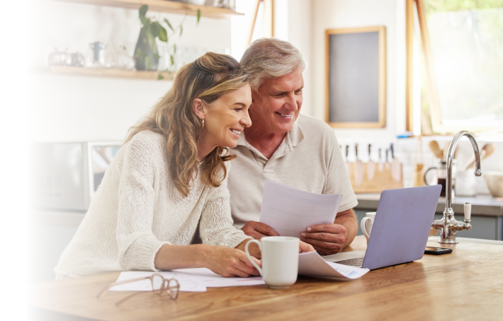 Couple sitting together, reviewing annuity options