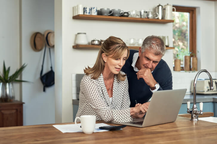 Couple looking at laptop