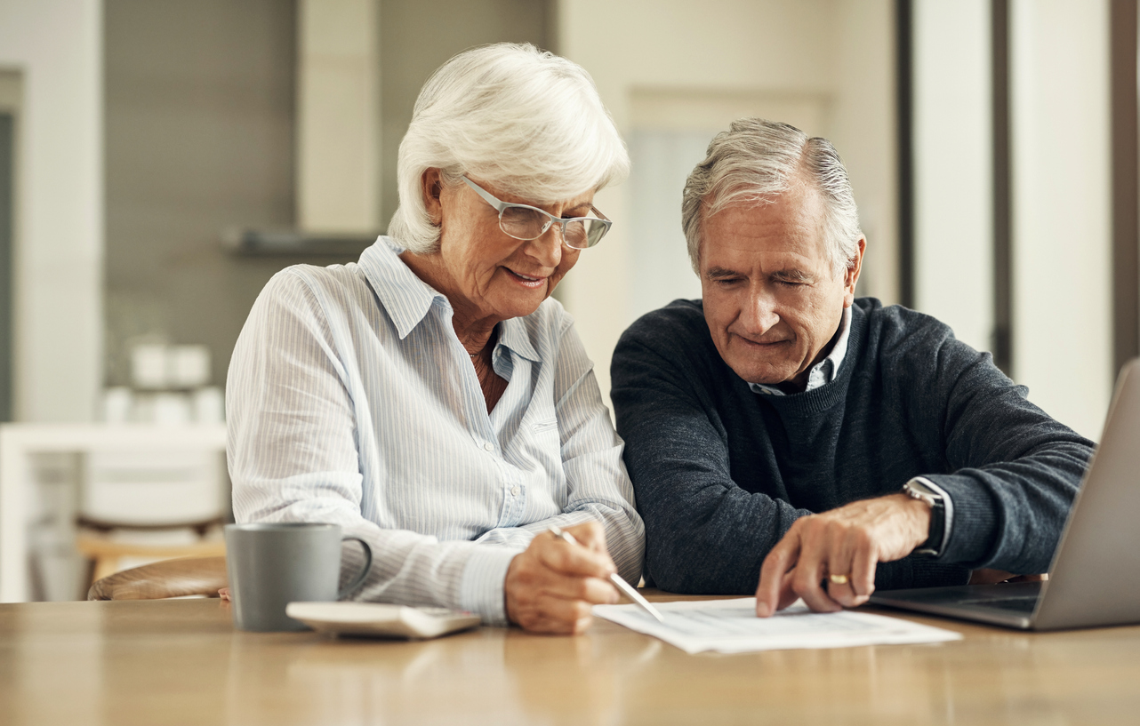 Older couple reviewing finances and paperwork