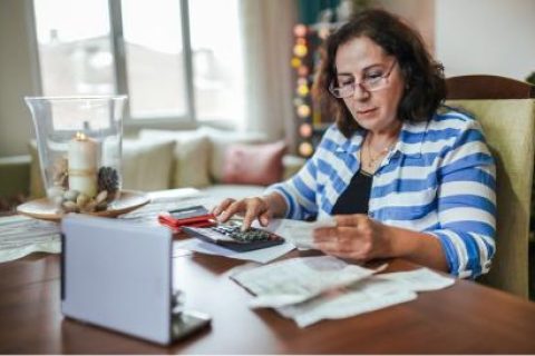 Older woman reviews finances to see if she should opt for an annuity alternative