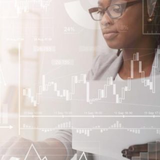 Photograph of a woman using her laptop with an overlay of graphs, charts, and financial data