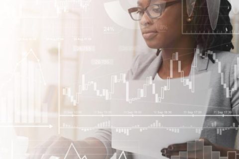 Photograph of a woman using her laptop with an overlay of graphs, charts, and financial data