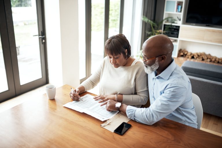 Senior couple preparing financial paperwork