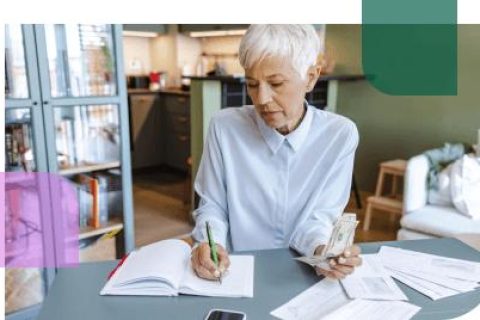 Older woman calculating figures